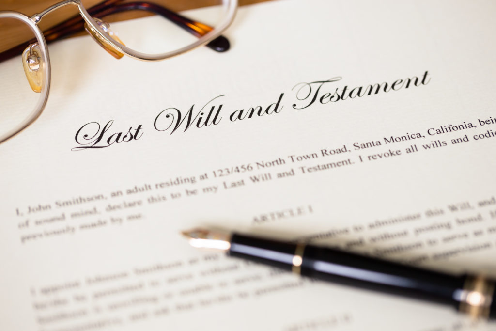 Last will and testament with pen and glasses concept for legal d