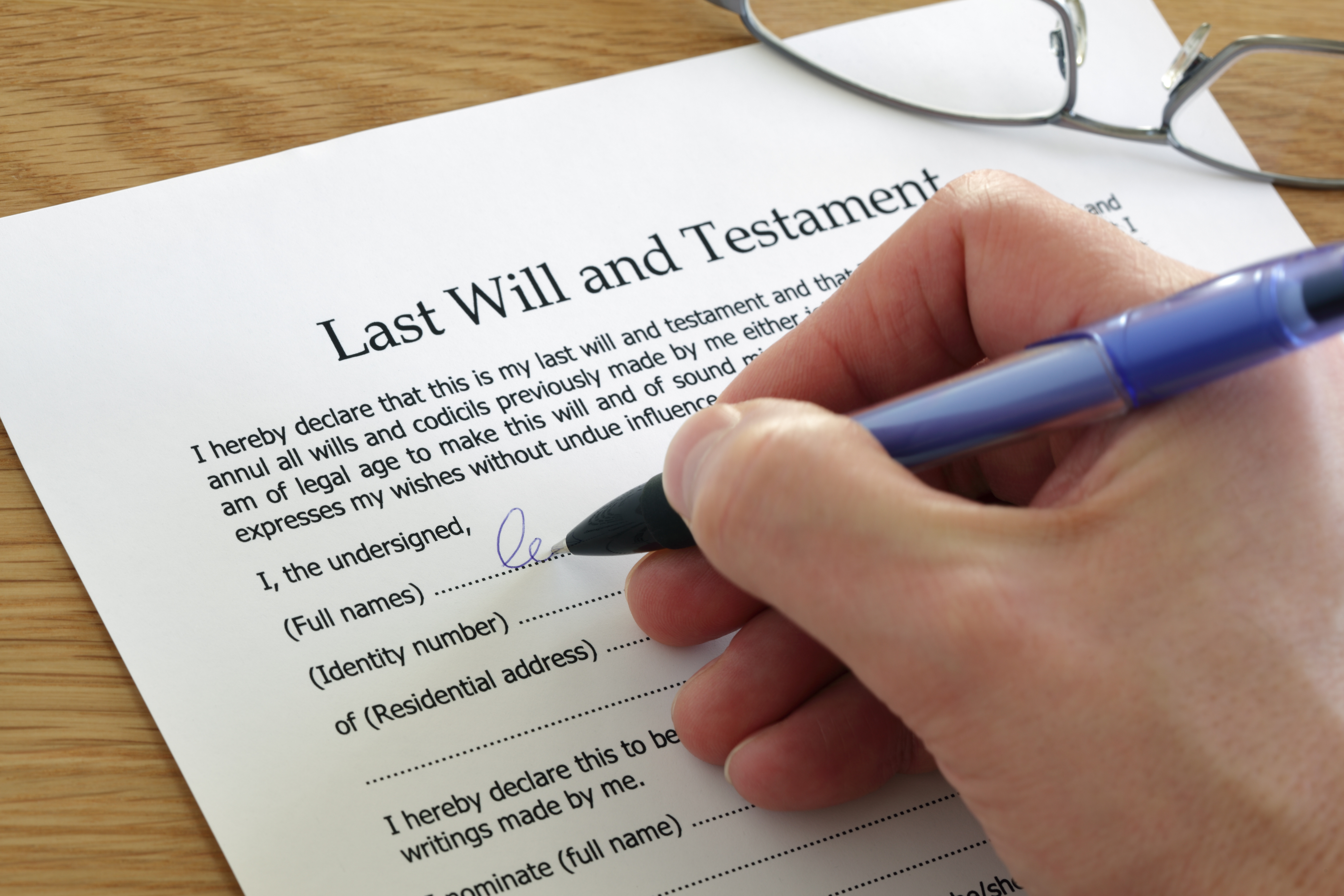 Signing Last Will and Testament document